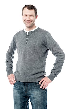 Happy man standing with hand on hips wearing casual clothes Stock Photo - Budget Royalty-Free & Subscription, Code: 400-08130930