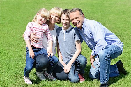 simsearch:400-07426233,k - Smiling family of four enjoying day out Stock Photo - Budget Royalty-Free & Subscription, Code: 400-08131138