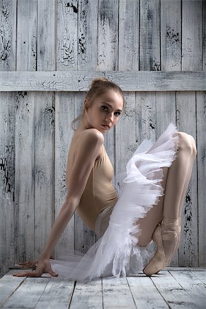 Studio shot, young graceful ballerina. Dancer standing on his toes. Stock Photo - Budget Royalty-Free & Subscription, Code: 400-08154595