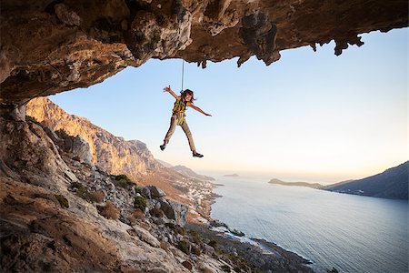 Seven-year old girl hanging on rope while lead climbing Stock Photo - Budget Royalty-Free & Subscription, Code: 400-08151304