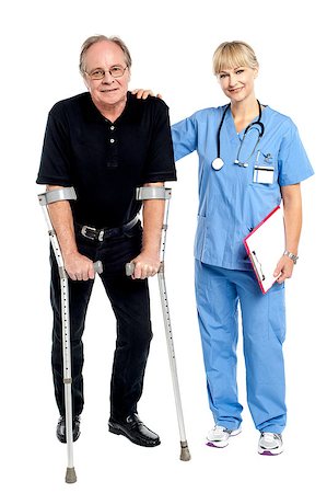 elder care - Physician supporting her courageous patient, helping him walk. Stock Photo - Budget Royalty-Free & Subscription, Code: 400-08151494