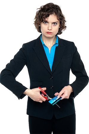simsearch:400-06858518,k - Annoyed businesswoman cutting cash card, staring at the camera. Stock Photo - Budget Royalty-Free & Subscription, Code: 400-08151937