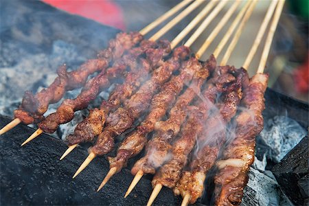 Delicious street food of Barbecued Lamb shish kebabs on the streets of Guilin, Guangxi Autonomous Region, China, Stock Photo - Budget Royalty-Free & Subscription, Code: 400-08152603