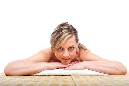 Matured naked woman lying on mattress, all prepared for spa care Photographie de stock - Aubaine LD & Abonnement, Code: 400-08153054
