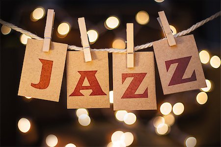 The word JAZZ printed on clothespin clipped cards in front of defocused glowing lights. Photographie de stock - Aubaine LD & Abonnement, Code: 400-08153762