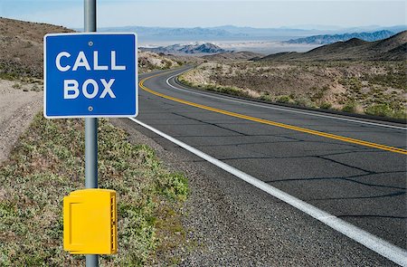 A sign informs motorists of telephone assistance available on a desert highway in California. Stock Photo - Budget Royalty-Free & Subscription, Code: 400-08153822