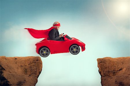 funny images of people driving - active senior superhero driving a car off a ravine Stock Photo - Budget Royalty-Free & Subscription, Code: 400-08153981