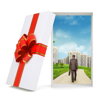 empty suitcase - Cityscape with walking businessman in gift box and with ribbon on isolated white background Stock Photo - Budget Royalty-Free & Subscription, Code: 400-08164860