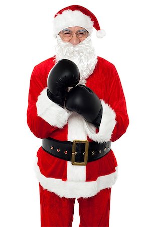 Aged cheerful Santa wearing boxing gloves, getting ready for the competition. Photographie de stock - Aubaine LD & Abonnement, Code: 400-08185645
