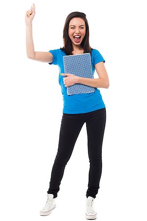 simsearch:400-06481645,k - Girl student raising her arm up and holding notebook, extremely excited. Stock Photo - Budget Royalty-Free & Subscription, Code: 400-08187344