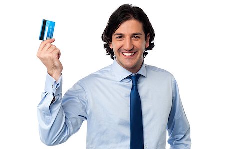simsearch:400-06858518,k - Smiling young corporate man holding up his credit card Stock Photo - Budget Royalty-Free & Subscription, Code: 400-08187494