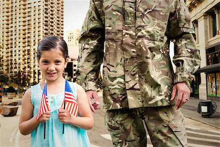 soldier with family - Soldier reunited with his daughter against new york street Stock Photo - Budget Royalty-Free & Subscription, Code: 400-08200448