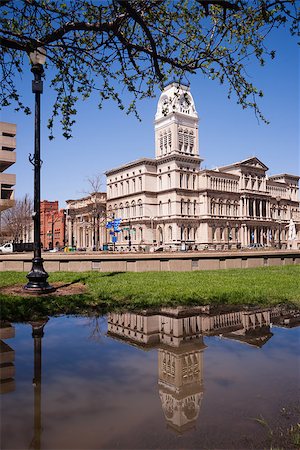 City Hall is reflected in water that has collected in the park across the street during recent flooding Stock Photo - Budget Royalty-Free & Subscription, Code: 400-08221540
