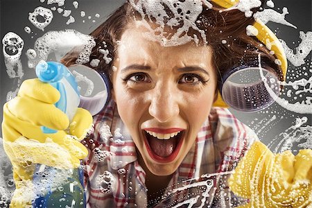 Desperate housewife screams while cleaning the glass Stock Photo - Budget Royalty-Free & Subscription, Code: 400-08254734