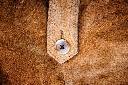 simsearch:400-04569718,k - Suede vest fragment with a button Stock Photo - Budget Royalty-Free & Subscription, Code: 400-08255212