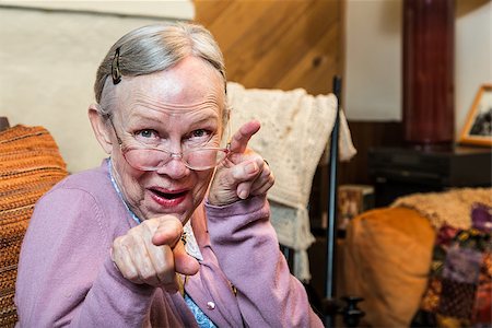 simsearch:400-07221782,k - Funny old woman in pink sweater showing dance style hand gesture Stock Photo - Budget Royalty-Free & Subscription, Code: 400-08255844