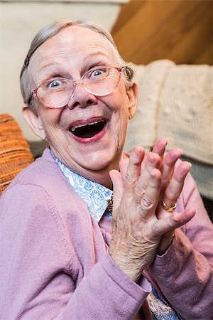 simsearch:400-07221782,k - Joyful old woman in pink sweater with hands together Stock Photo - Budget Royalty-Free & Subscription, Code: 400-08255845