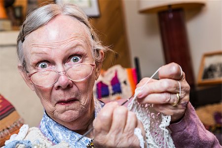 simsearch:400-07221782,k - Elderly woman crocheting while looking at camera Stock Photo - Budget Royalty-Free & Subscription, Code: 400-08255858