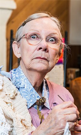 simsearch:400-07221782,k - Startled old woman with crochet in livingroom Stock Photo - Budget Royalty-Free & Subscription, Code: 400-08255864