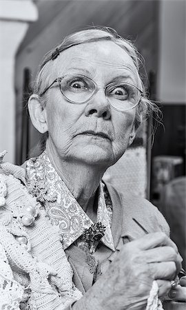 simsearch:400-07221782,k - Scared old woman with crochet in living room Stock Photo - Budget Royalty-Free & Subscription, Code: 400-08255865