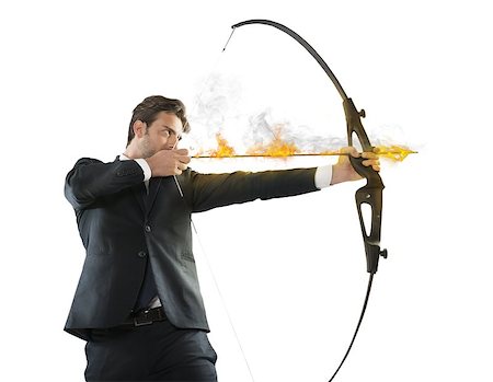 Determinated businessman with flaming arrow takes aim Stock Photo - Budget Royalty-Free & Subscription, Code: 400-08256039