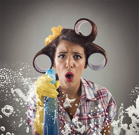 Housewife cleans with soap and detergent spray Stock Photo - Budget Royalty-Free & Subscription, Code: 400-08256191