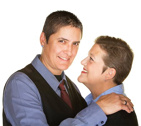 simsearch:400-06204561,k - Cheerful lesbian couple embracing over isolated background Stock Photo - Budget Royalty-Free & Subscription, Code: 400-08250375