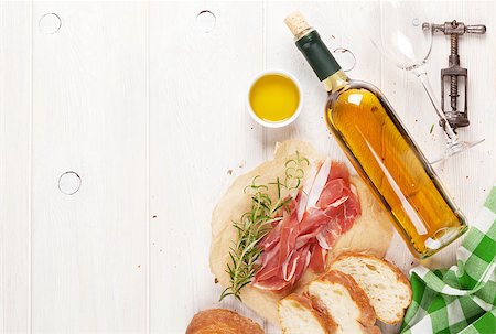 simsearch:400-06207145,k - Prosciutto, wine, ciabatta, parmesan and olive oil on wooden table. Top view with copy space Stock Photo - Budget Royalty-Free & Subscription, Code: 400-08251582