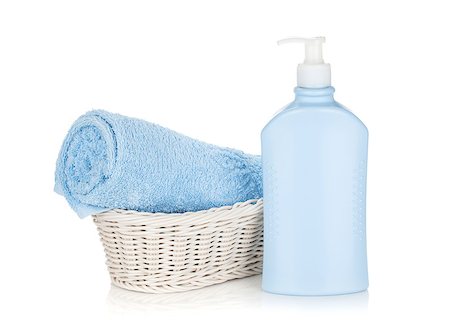 simsearch:400-05370670,k - Shampoo bottle and blue towel. Isolated on white background Stock Photo - Budget Royalty-Free & Subscription, Code: 400-08253110