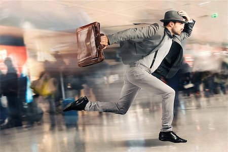 people running scared - Late tourist man runs fast in airport Stock Photo - Budget Royalty-Free & Subscription, Code: 400-08253800