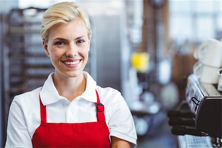 simsearch:400-07750853,k - Pretty barista smiling at the camera at the cafe Stock Photo - Budget Royalty-Free & Subscription, Code: 400-08265817
