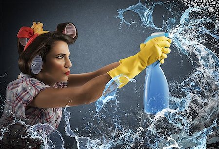 Housewife cleans determined with much cleaner spray Stock Photo - Budget Royalty-Free & Subscription, Code: 400-08261730