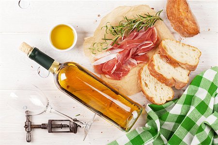 simsearch:400-06207145,k - Prosciutto, wine, ciabatta, parmesan and olive oil on wooden table. Top view Stock Photo - Budget Royalty-Free & Subscription, Code: 400-08286483