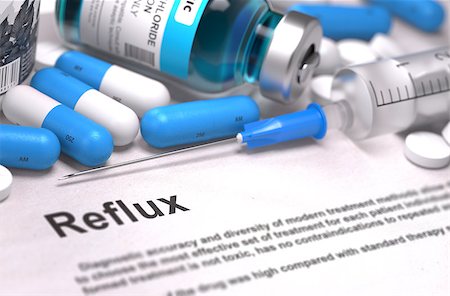 Diagnosis - Reflux. Medical Concept with Blue Pills, Injections and Syringe. Selective Focus. Blurred Background. Stock Photo - Budget Royalty-Free & Subscription, Code: 400-08286849