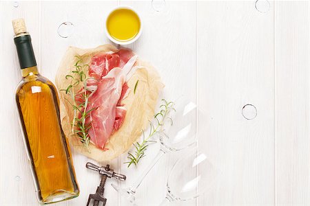 simsearch:400-06207145,k - Prosciutto and wine on wooden table. Top view with copy space Stock Photo - Budget Royalty-Free & Subscription, Code: 400-08288469