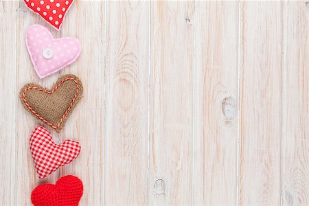 simsearch:400-07919385,k - Valentines day background with toy hearts over white wooden table Stock Photo - Budget Royalty-Free & Subscription, Code: 400-08295064