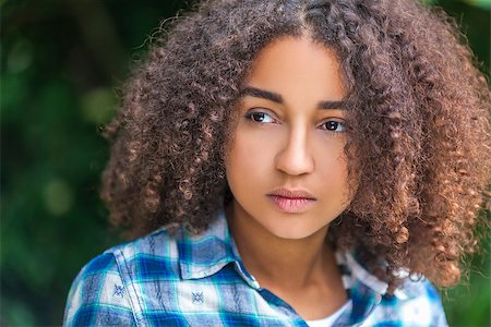 sad african children - Outdoor portrait of beautiful happy mixed race African American girl teenager female child looking thoughtful or sad Stock Photo - Budget Royalty-Free & Subscription, Code: 400-08295344