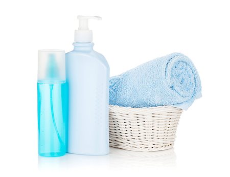 simsearch:400-05370670,k - Cosmetics bottles and blue towel. Isolated on white background Stock Photo - Budget Royalty-Free & Subscription, Code: 400-08295757