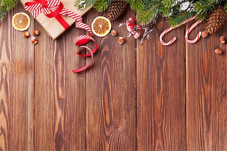 Christmas gift box, food decor and fir tree branch on wooden table. Top view with copy space Stock Photo - Budget Royalty-Free & Subscription, Code: 400-08298083
