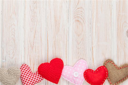 simsearch:400-07919385,k - Valentines day background with toy hearts over white wooden table Stock Photo - Budget Royalty-Free & Subscription, Code: 400-08298169
