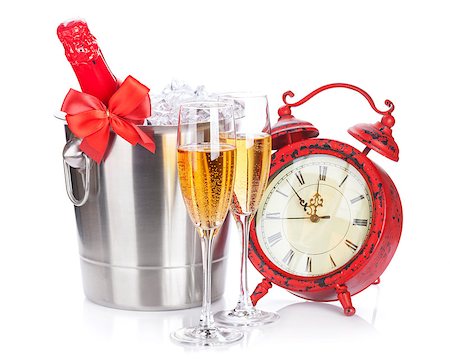 simsearch:400-07166551,k - Two champagne glasses, bottle in cooler and clock. Isolated on white background Stock Photo - Budget Royalty-Free & Subscription, Code: 400-08291423