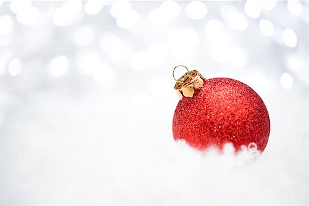 simsearch:400-05693036,k - Christmas Decoration with Red Ball in the Snow on the Blurred Background with Holiday Lights. Greeting Card with Space for Your Text Stock Photo - Budget Royalty-Free & Subscription, Code: 400-08300700