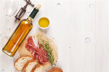 simsearch:400-06207145,k - Prosciutto, wine, ciabatta, parmesan and olive oil on wooden table. Top view with copy space Stock Photo - Budget Royalty-Free & Subscription, Code: 400-08300718