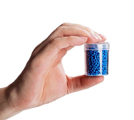 polymer - Man holding a small container with blue plastic granules, used for manufacturing. Stock Photo - Budget Royalty-Free & Subscription, Code: 400-08316027