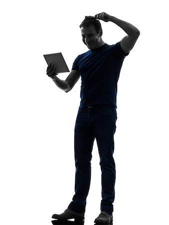 one  man holding digital tablet brushing hair in silhouette on white background Photographie de stock - Aubaine LD & Abonnement, Code: 400-08317010