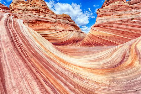 swirling rock formation - The Wave is an awesome vivid swirling petrified dune sandstone formation in Coyote Buttes North. It could be seen in Paria Canyon-Vermilion Cliffs Wilderness, Arizona. USA Stock Photo - Budget Royalty-Free & Subscription, Code: 400-08317497