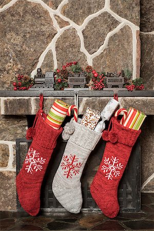 Stuffed stockings hanging on a fireplace on christmas morning Stock Photo - Budget Royalty-Free & Subscription, Code: 400-08317760