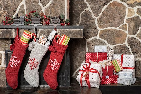 Stuffed stockings hanging on a fireplace on christmas morning Stock Photo - Budget Royalty-Free & Subscription, Code: 400-08317761