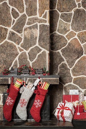 Stuffed stockings hanging on a fireplace on christmas morning Stock Photo - Budget Royalty-Free & Subscription, Code: 400-08318020
