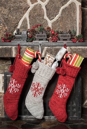 Stuffed stockings hanging on a fireplace on christmas morning Stock Photo - Budget Royalty-Free & Subscription, Code: 400-08318627